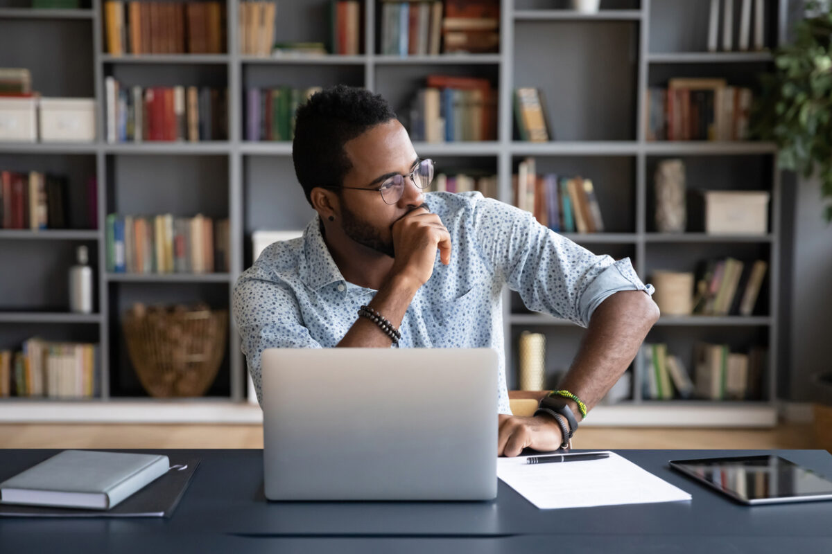 Business leader reflecting on imposter syndrome and leadership confidence
